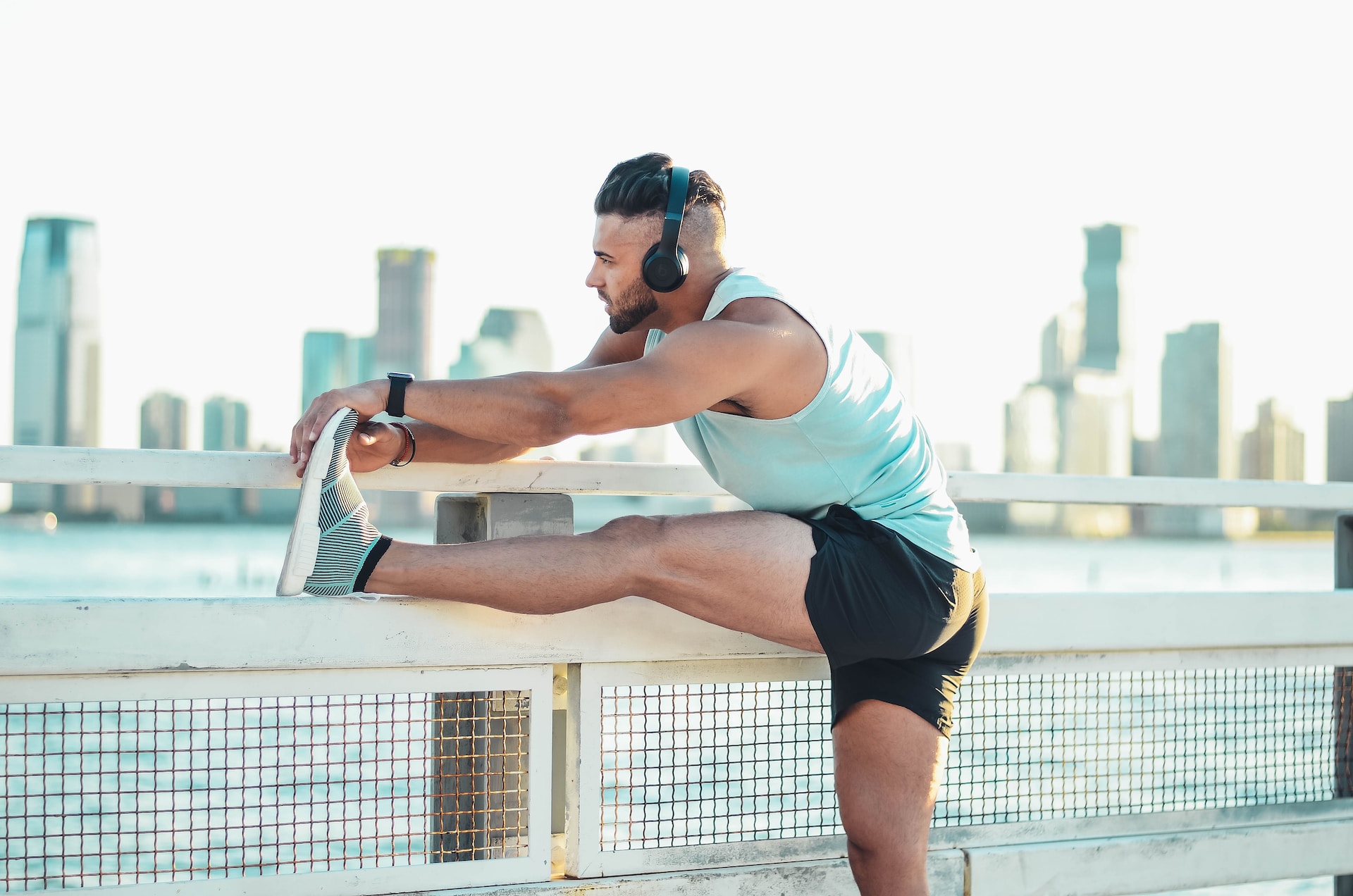 Man stretching his legs wearing headphones